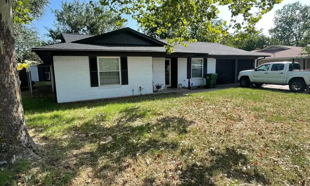 Professional roofing crew working on a residential roof in Grand Terrace